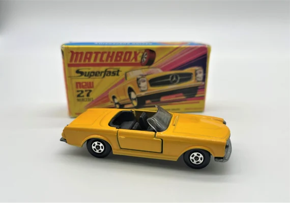 The article traces the journey of Matchbox from its post-WWII origins, becoming a toy-car industry leader, to its eventual sale to Mattel.